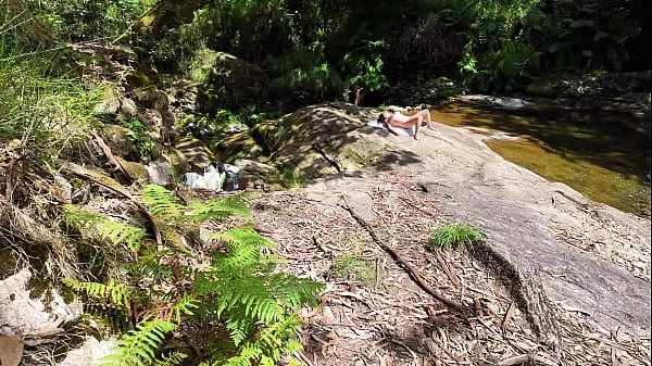 An impudent Voyeur Fingered a Naked Milf on a Nudist Beach in the Forest