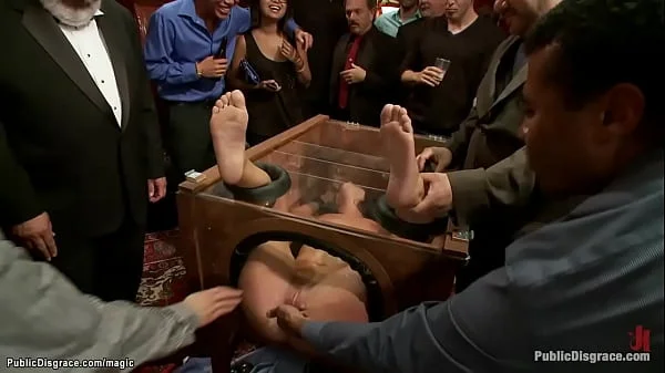 Slut in wooden glass box public fucked