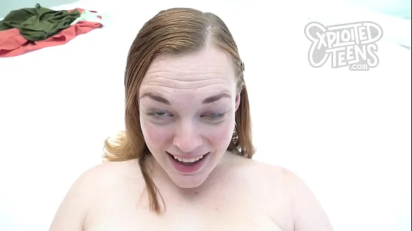 This redheaded teen with D cup tits sucks cock
