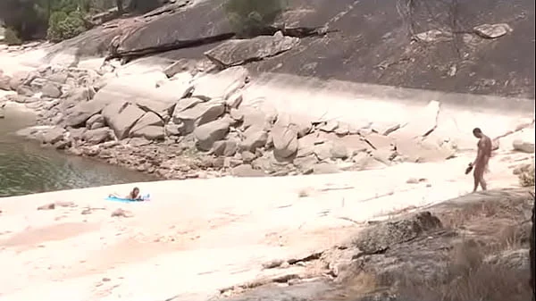 Black dude looks for horny babes at the nude beach and bangs one of 'em