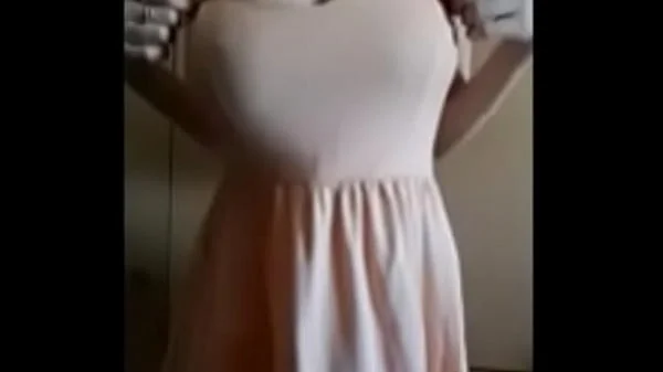 Woman undressing with a perfect tits and a perfect body
