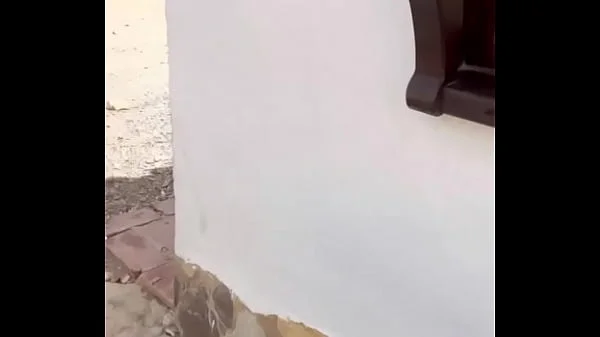 Two lesbians touch each other to orgasm on the corner of a town trying to avoid being seen by anyone